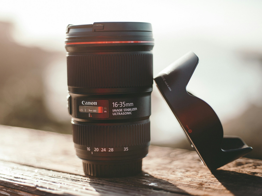 A canon lens on a table