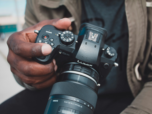 A man holding a Lumix Camera